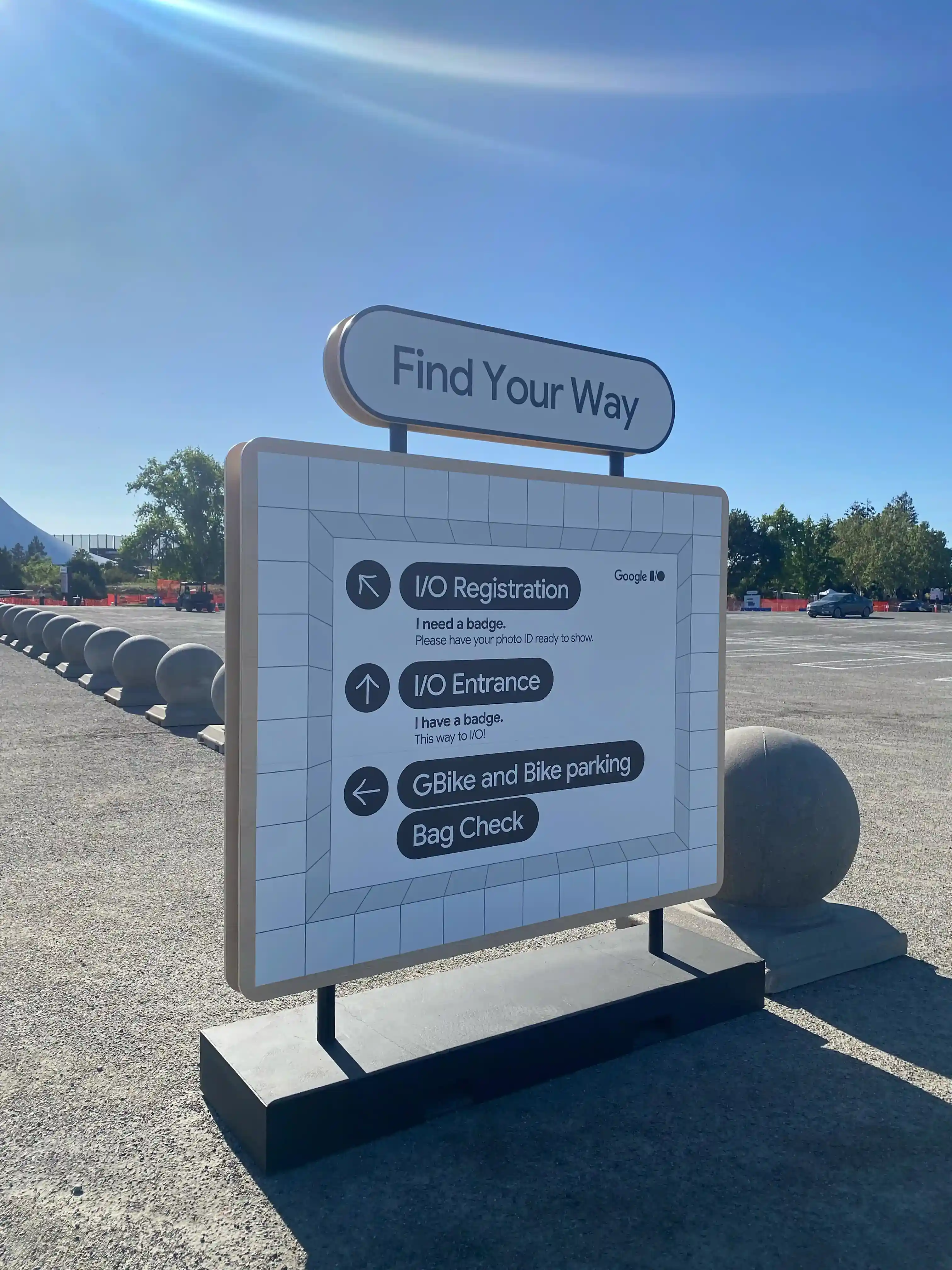 A directional sign. "Find Your Way" is written large, with paths to I/O Registration, I/O Entrance, GBike and Bike Parking, and Bag Check