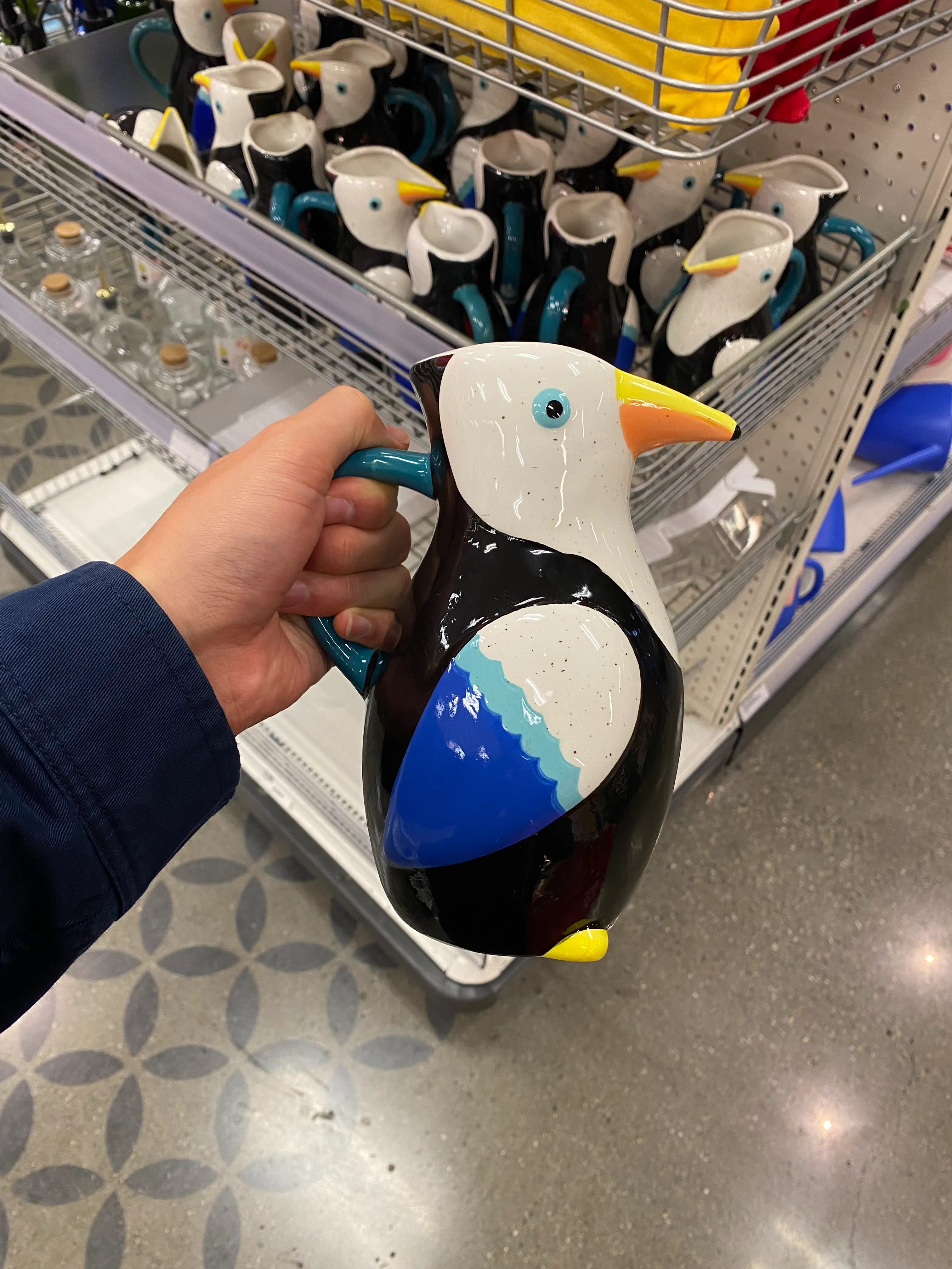 A bird-shaped watering can.