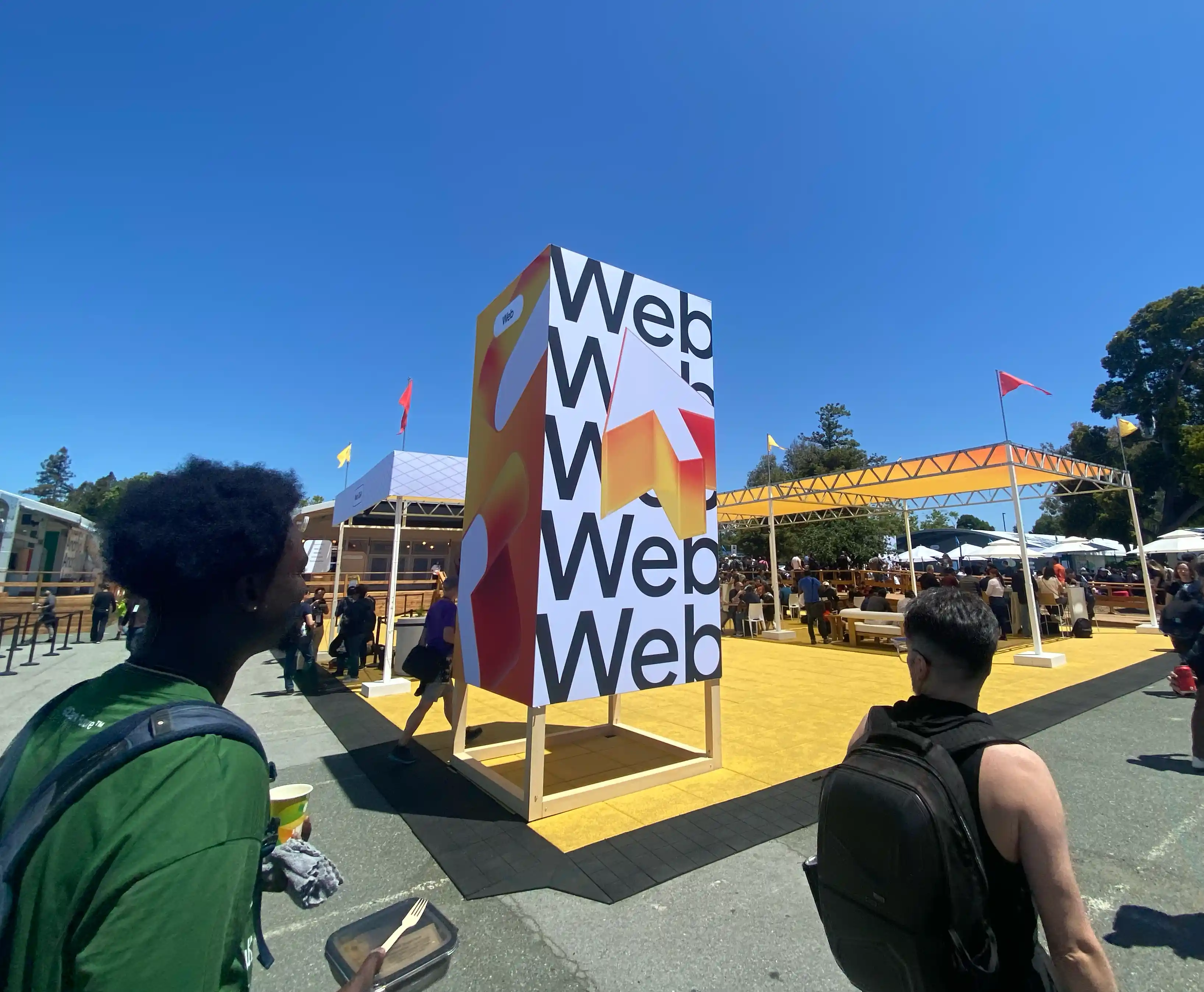 A signboard is visible. A large mouse cursor is drawn on a background filled with the word "Web", and "Web" is also written on the side.